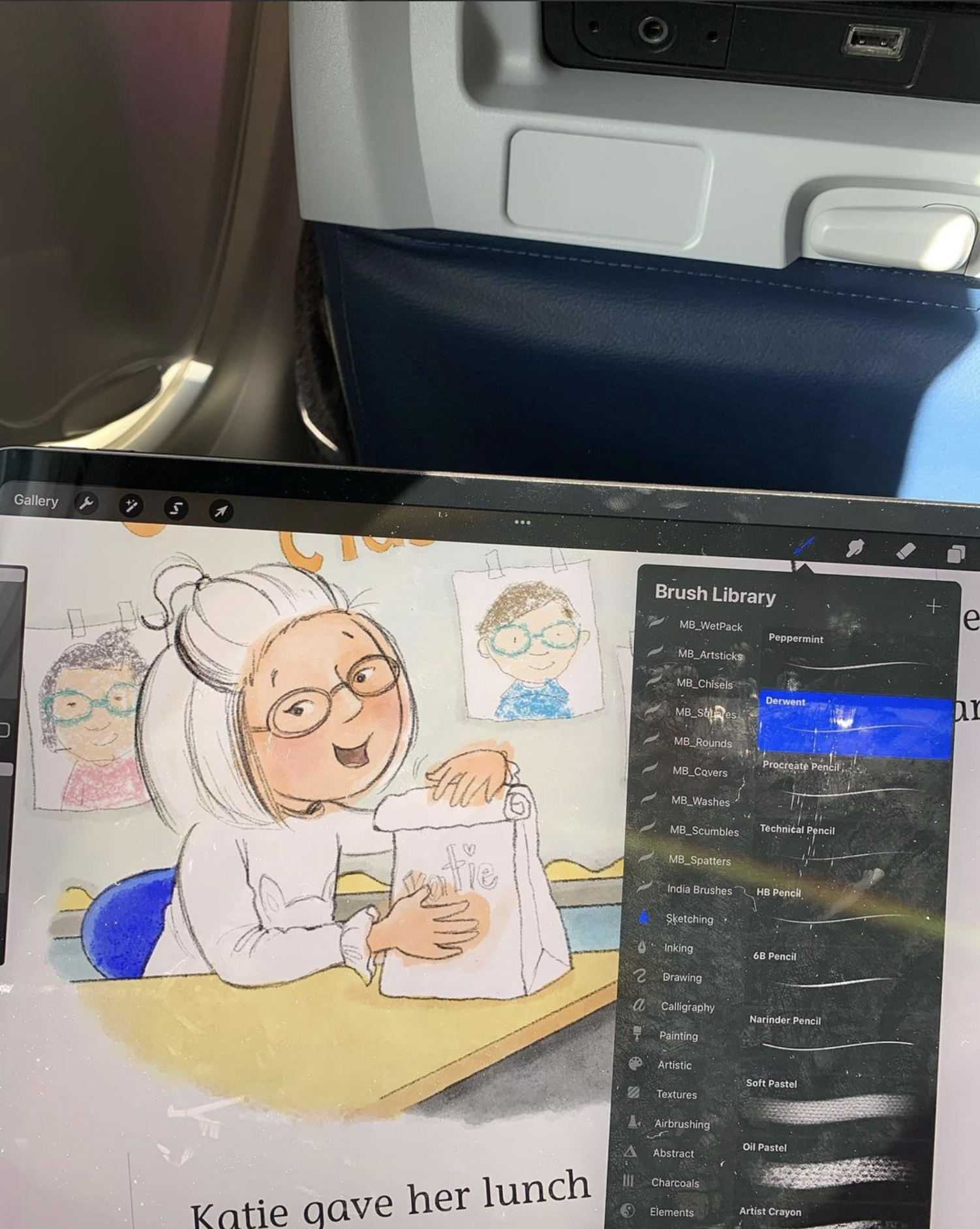 Tammie working on Katie Woo on iPad Pro while on an aeroplane